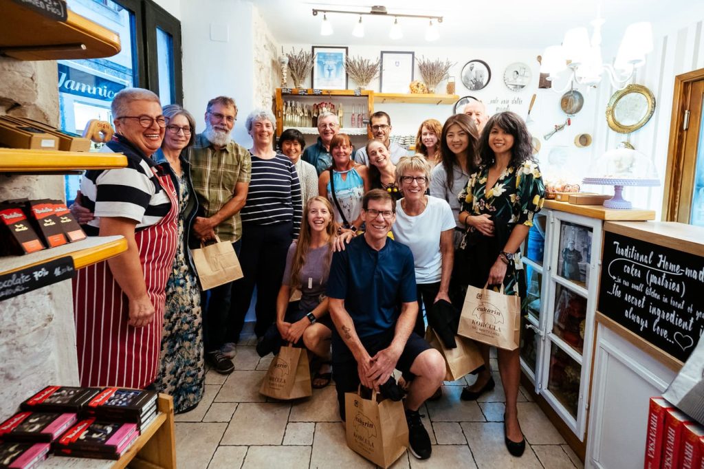 Cycling group visiting a local pastry shop in Croatia