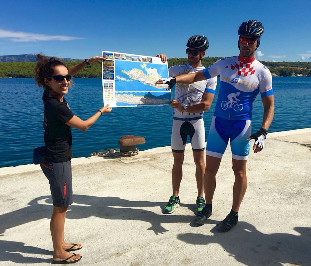 Cycling guide explaining the route map during a bike tour in Croatia